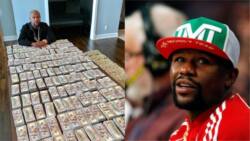 Mayweather poses with huge amount of cash as he blasts his critics (photos)