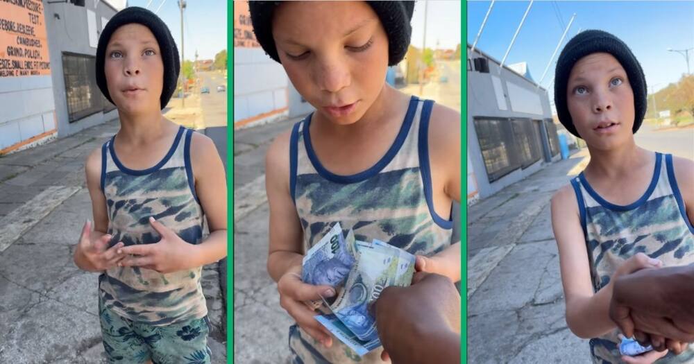 Boy receives money from BI Phakathi
