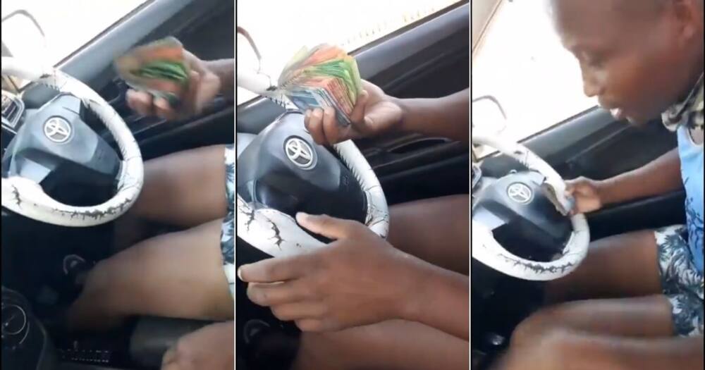 A video of a man driving while flaunting a stash of money has caught Mzansi's attention. Image: @KeletsoMSS/Twitter