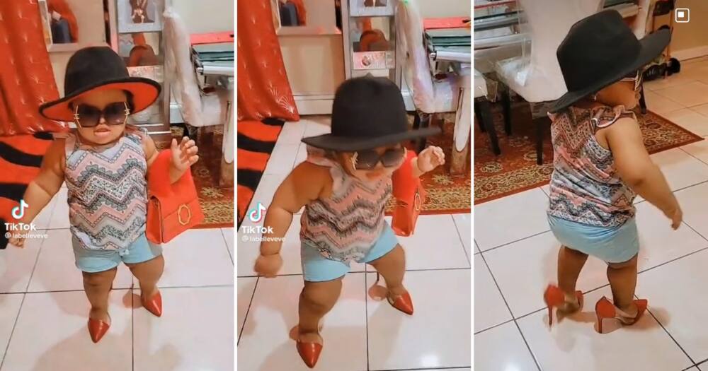 A toddler wore her mother's clothes