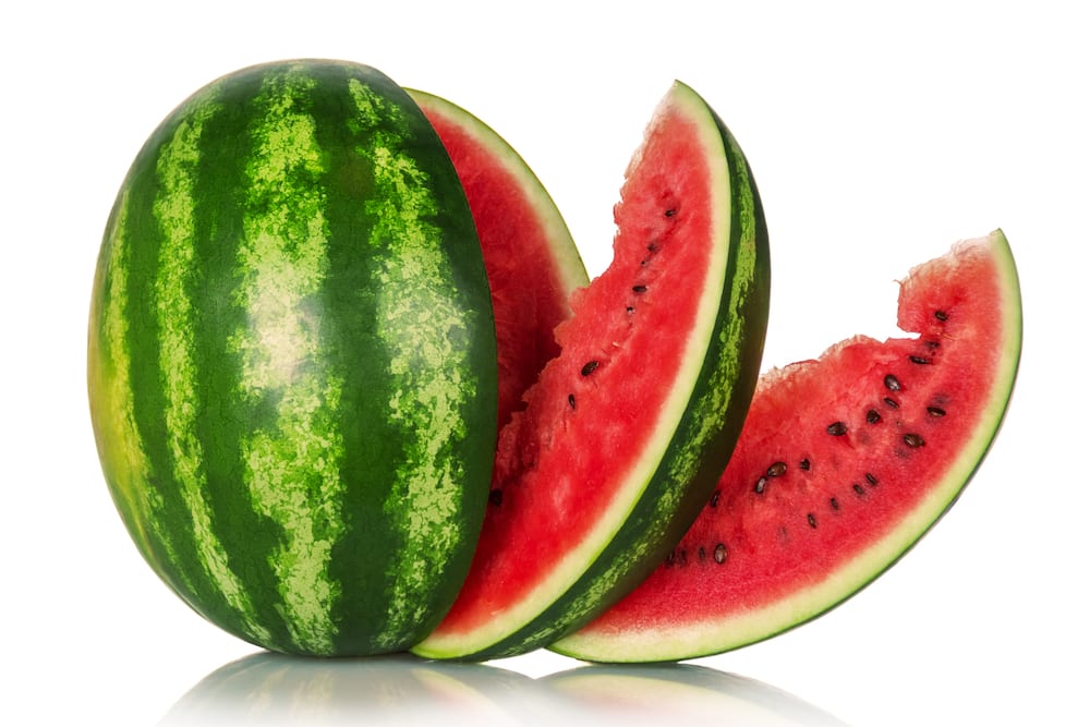 Watermelon and several slices isolated on white background.