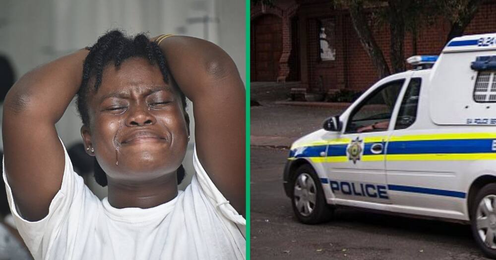 A woman crying and police van