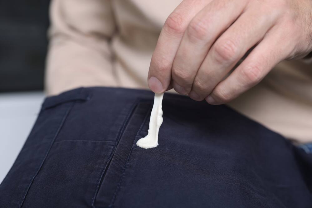 Chewing gum stuck on black pants