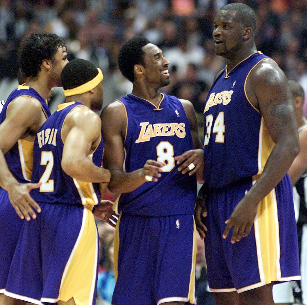How many 5 Guys Does Shaq own?