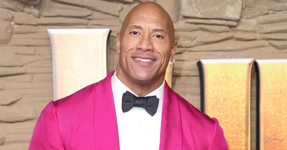 The Rock surprised a teacher who graduated from university after being a school cleaner for more than 20 years. Photo: Getty Images.