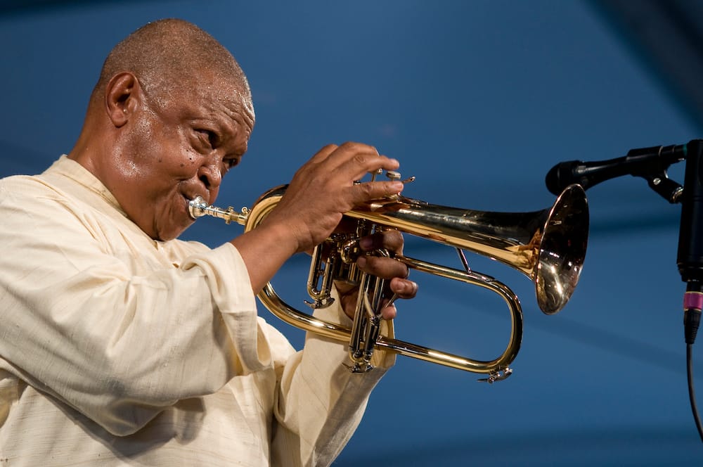 Hugh Masekela performs on stage at the New Orleans Jazz & Heritage Festival