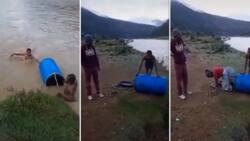 Mmusi Maimane shares heartbreaking video of gogo shoved in a drum cross a river, says government is inhumane