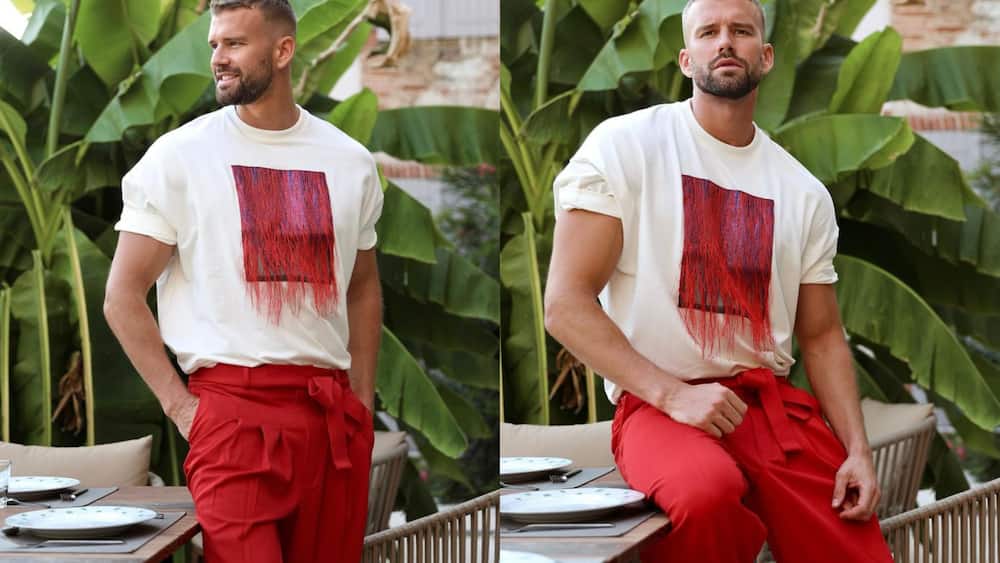 White round-neck T-shirt and red pants with a wrap-around tie at the waist