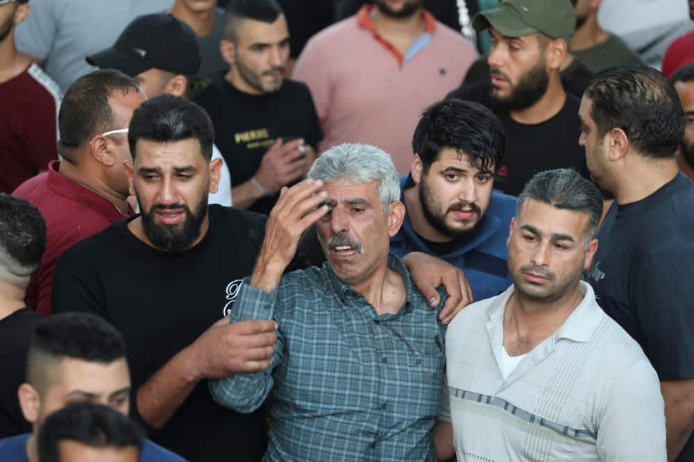 Mourners outside a hospital in Nablus on Sunday morning