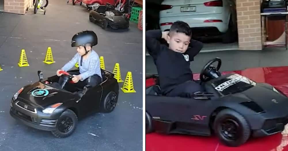 little boy drifts toy cars