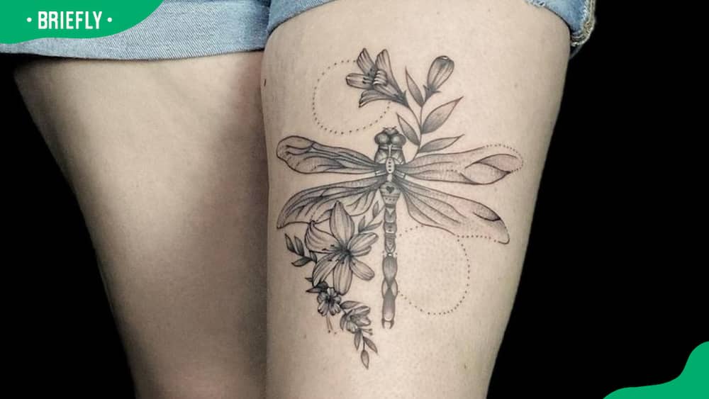 giant thigh dragonfly tattoo