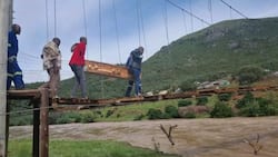 "20 years": Villagers forced to cross river using rickety "temporary" bridge for decades