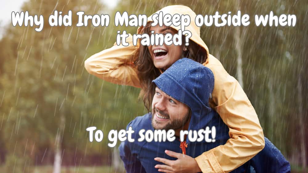 Couple smiling in the rain