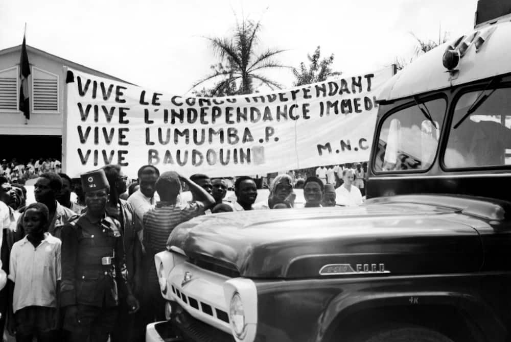 In a photo released in December 1960, Congolese in Stanleyville, as Kisangani used to be called, support Lumumba as King Baudouin of Belgium visits the former colony