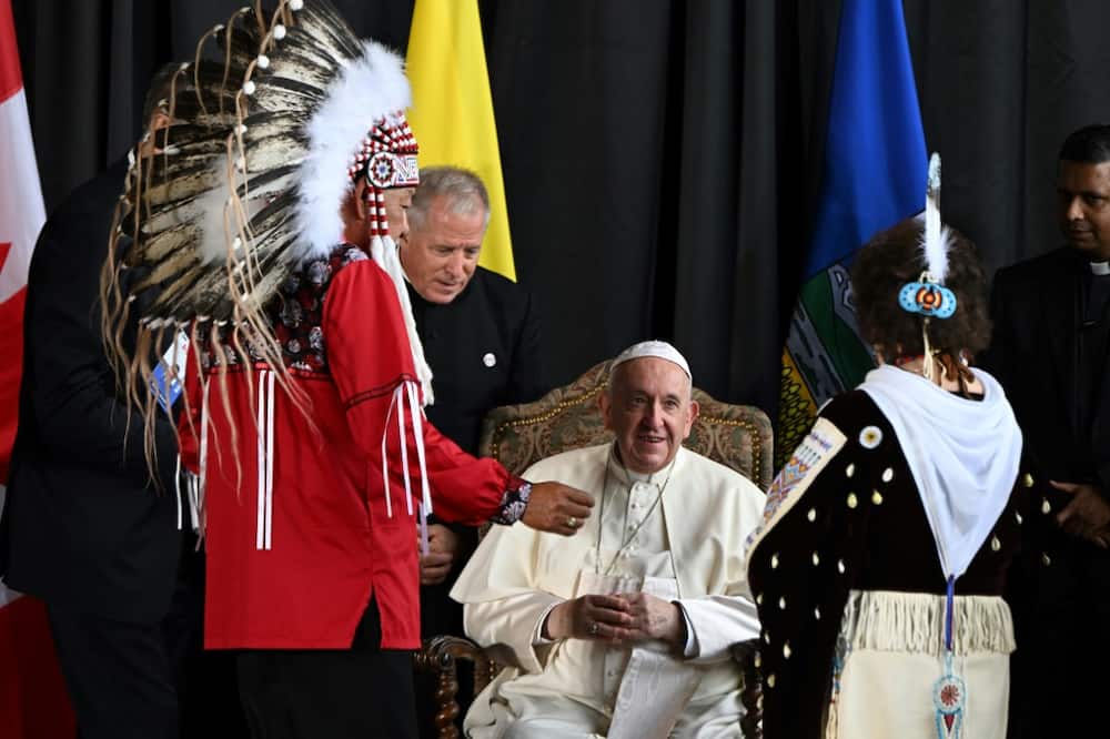 Pope Francis speaks with George Arcand (L), grand chief of the Confederacy of Treaty Six First Nations, and other Indigenous leaders during a welcoming ceremony at Canada's Edmonton International Airport on July 24, 2022