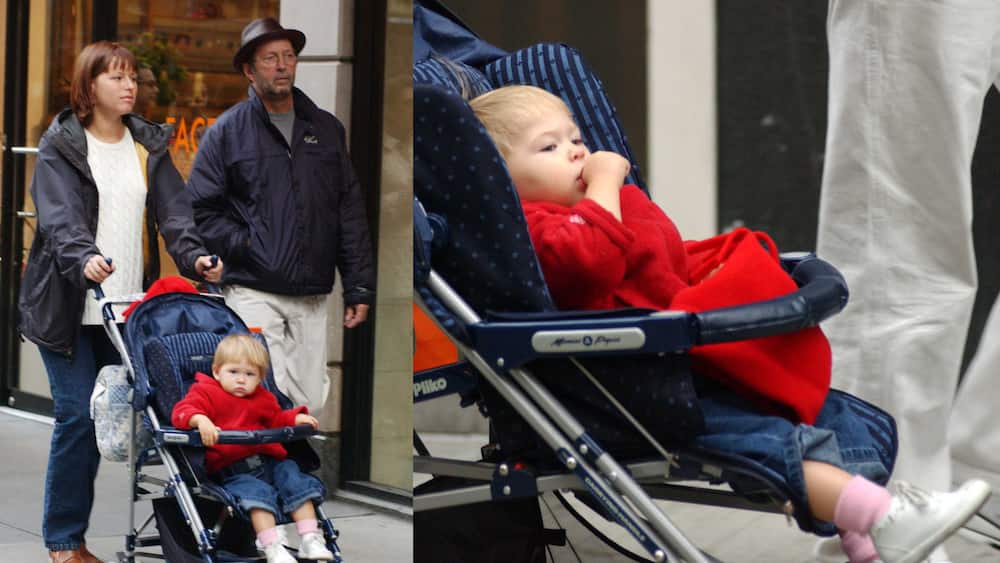 Eric Clapton with his wife Melia McEnery and their baby Julie Rose during a walk on Madison Avenue 28 October 2002 in New York City.