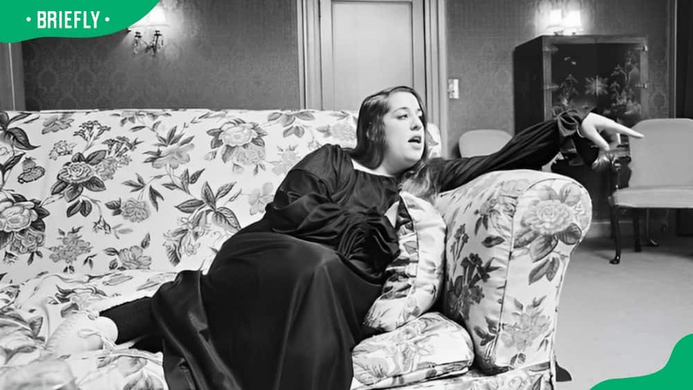 Cass Elliot seating on a chair