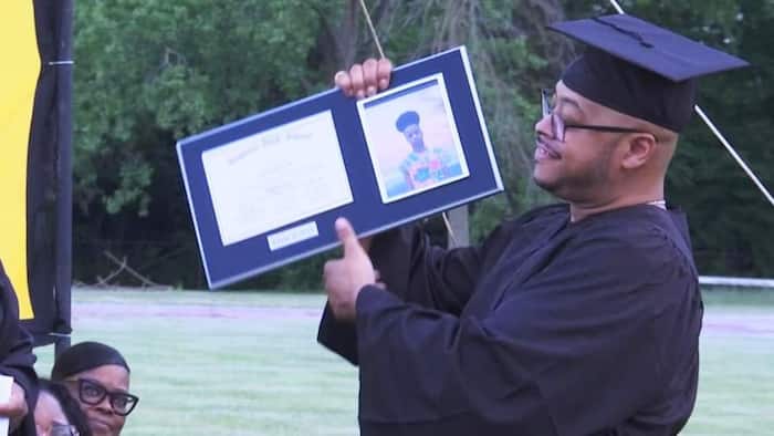 Proud father accepts son's diploma after losing him in car accident