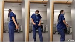 Nurse dances during night shift break at work, quickly looks around to see if anyone is coming in video