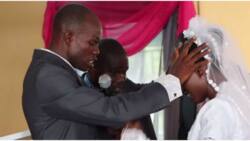 "This is not normal": Reactions as groom lays hands on bride during wedding, sprays in tongues