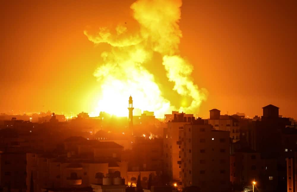 Fires are seen following an Israeli airstrike in Gaza city on July 16, 2022