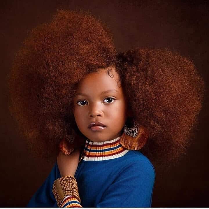 Afro puff with a side part.