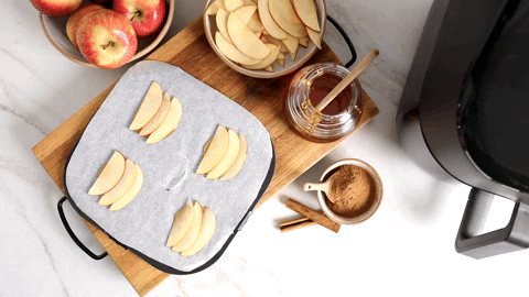 Preparing puff pastries with apple