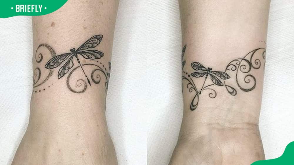 Girly dragonfly bracelet tattoo