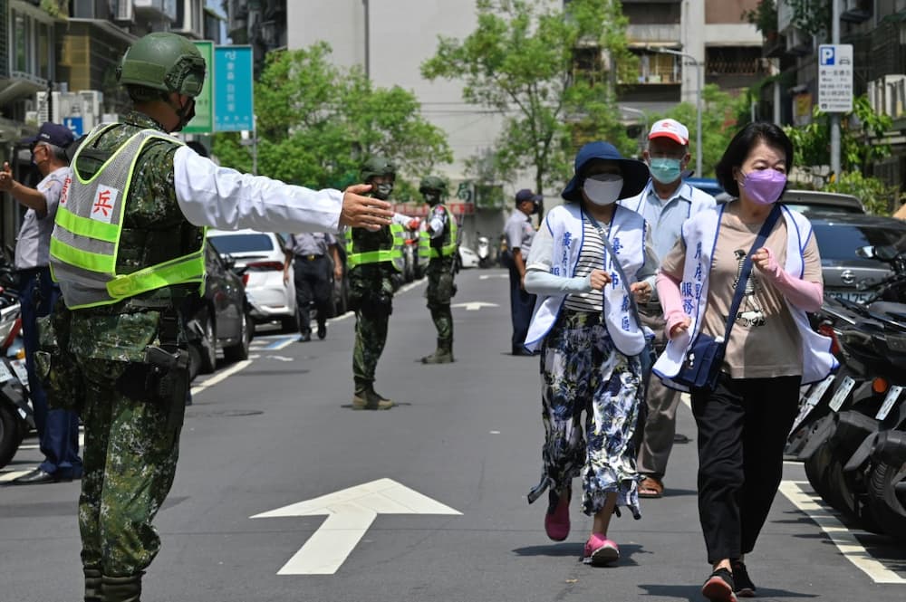 Civilians clear the streets in Taipei as part of an air-raid drill