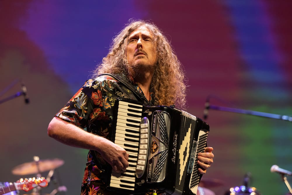 Comedy musician Weird Al performing on stage