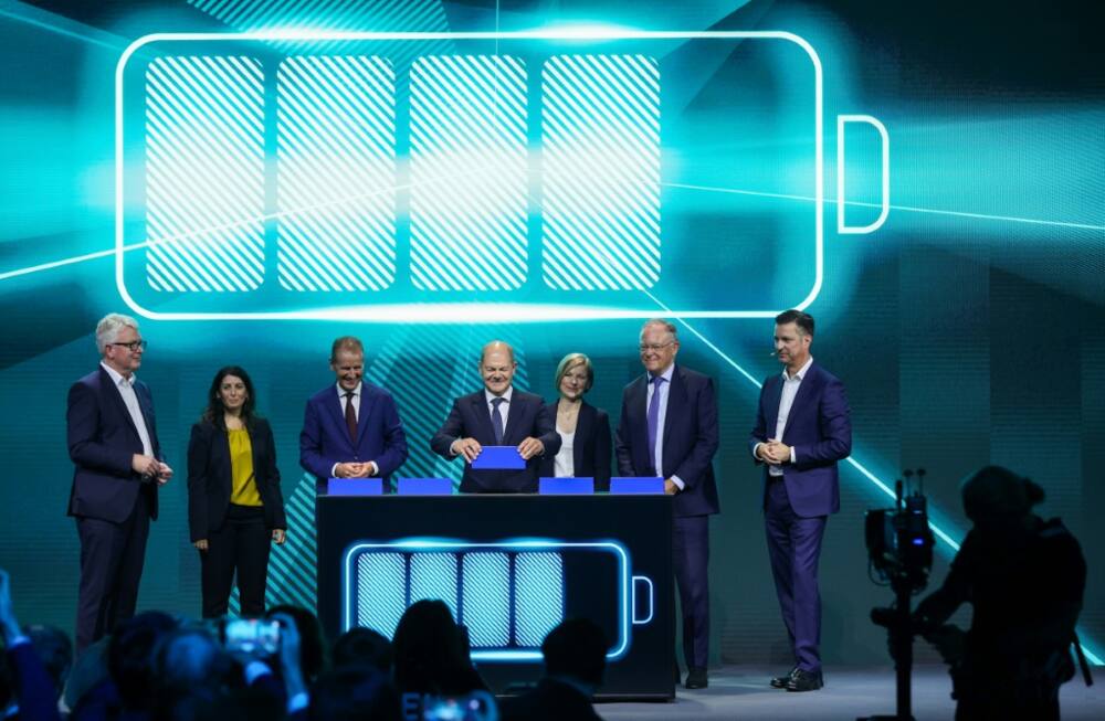 German Chancellor Olaf Scholz symbolically plugs in a battery as Volkswagen began construction of its first factory to make batteries for its electric cars German Chancellor Olaf Scholz symbolically plugs in a battery as Volkswagen began construction of its first factory to make batteries for its electric cars