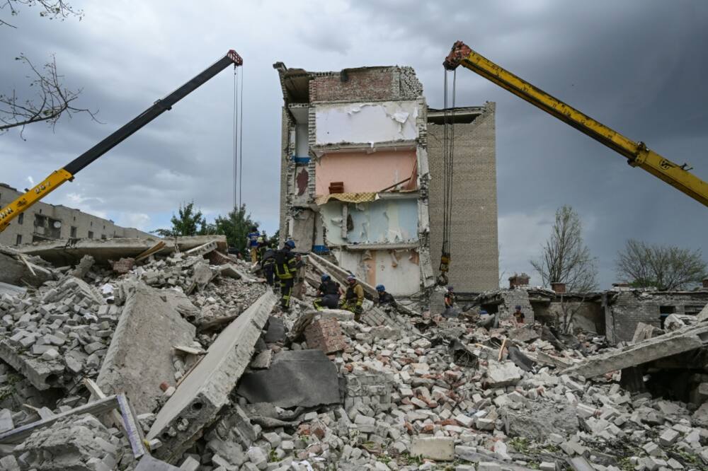 Rescue teams are struggling to reach people buried under the rubble of an apartment building in Chasiv Yar