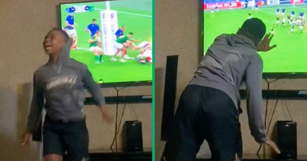 Young man trends for epic reaction during rugby match.