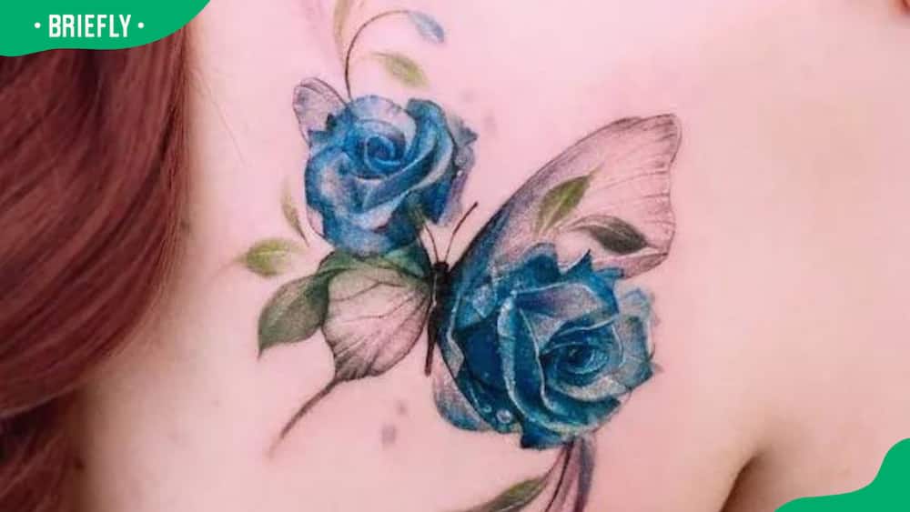 Blue rose and butterfly tattoo