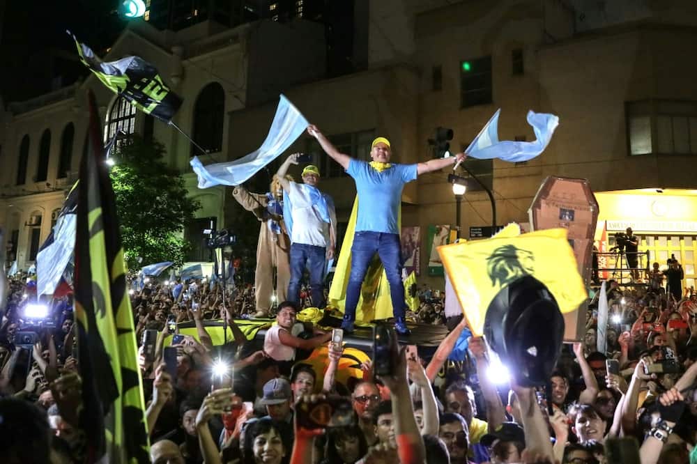 Supporters of Argentine president-elect Javier Milei celebrate his victory