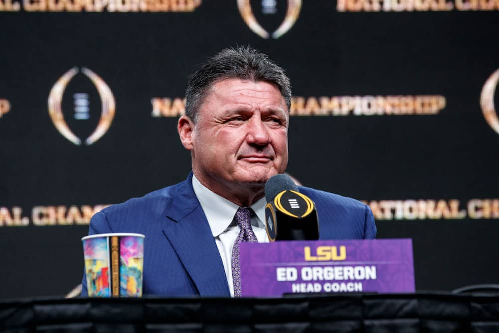 Former LSU head football coach, Ed Orgeron, right, talks to his girlfriend  Bailie Lauderdale during the third quarter of an NCAA college football game  between Texas A&M and Miami on Saturday, Sept.