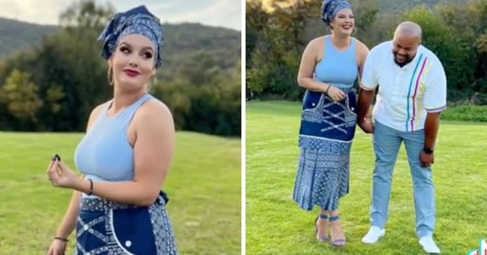 A white makoti trended for flexing bare arms in a traditional outfit.
