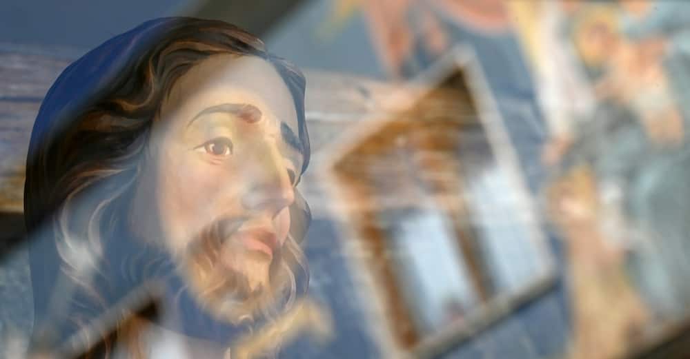 In the picturesque Alpine village, Jesus and his disciples are everywhere -- from paintings on the the facades of old houses to carved wooden figures in shop windows
