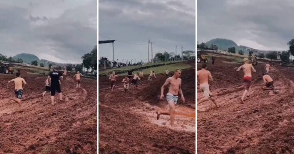 Grown men racing each other around a muddy tarck