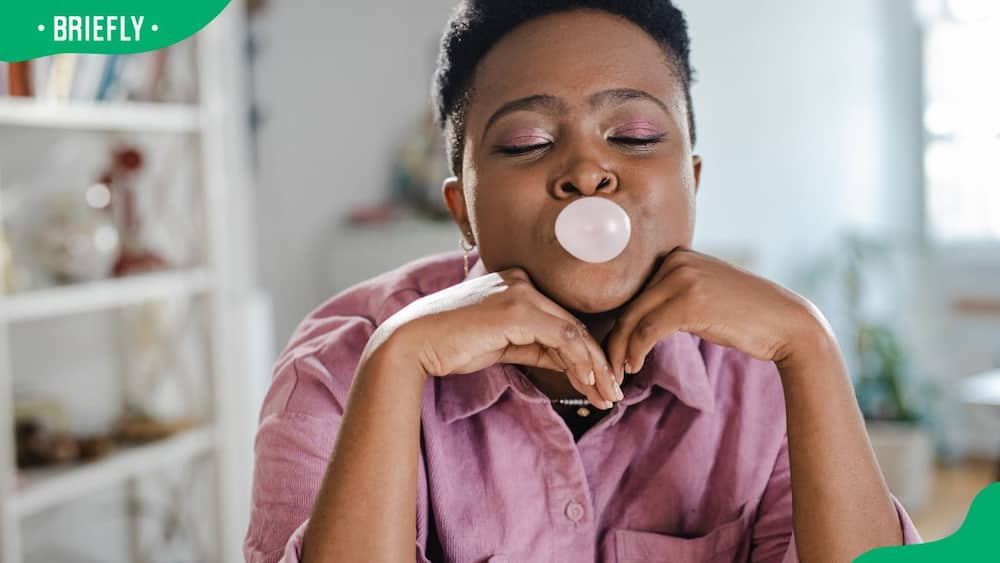 A woman enjoying a bubble gum