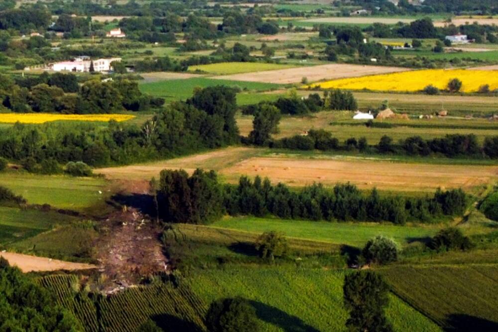 The crash site surrounded by fields was visible from the air
