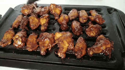 Preparing sticky BBQ chicken wings
