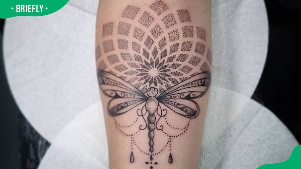 Tribal dragonfly tattoo with mandala prints