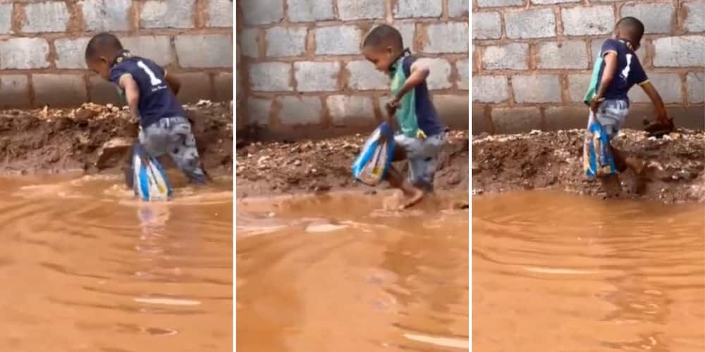 A boy walking in flooded streets with bread