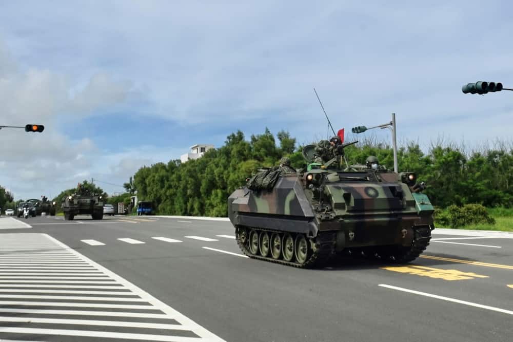 Taiwanese heavy military vehicles travel down a road near Magong on the Penghu islands in the Taiwan Strait in May 2022