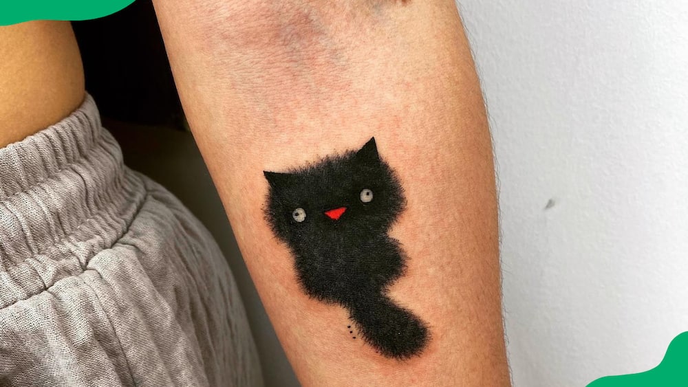 Wrist fluffy kitten tattoo