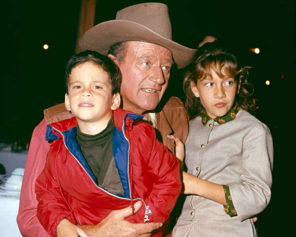 John Wayne with two of his children, son John Ethan and daughter Aissa.