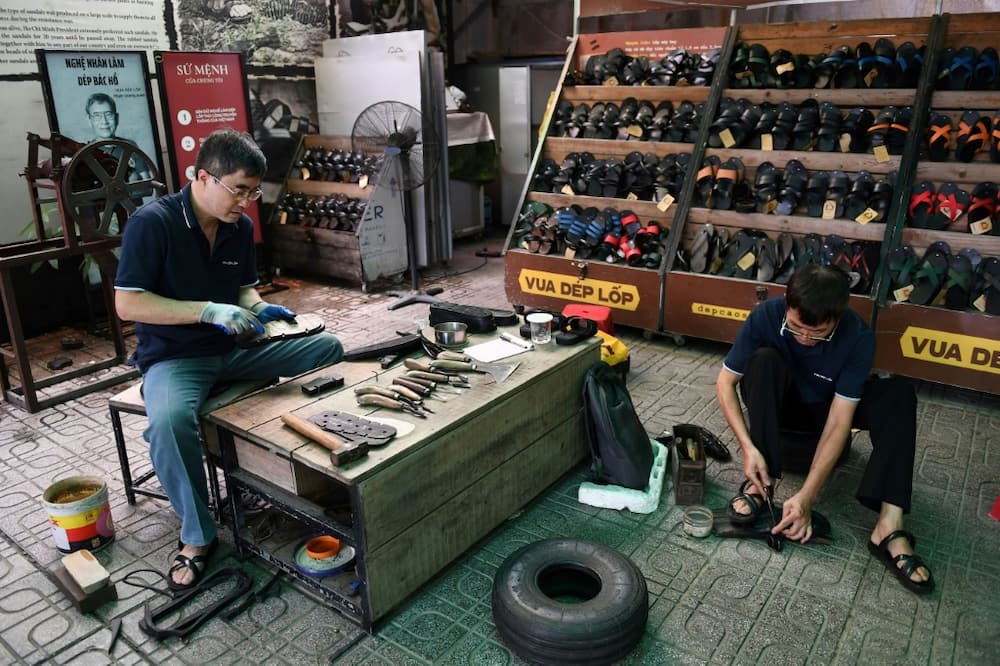 Shoemakers use sharp knives and chisels to craft the sandals from huge tyres