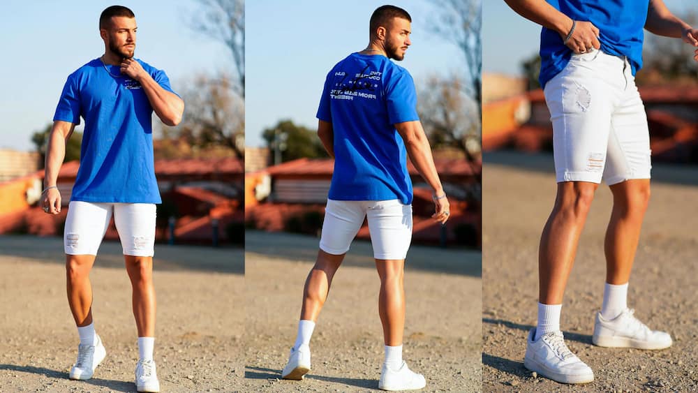 Distressed white slim-fit denim shorts with a loose-fitting blue T-shirt