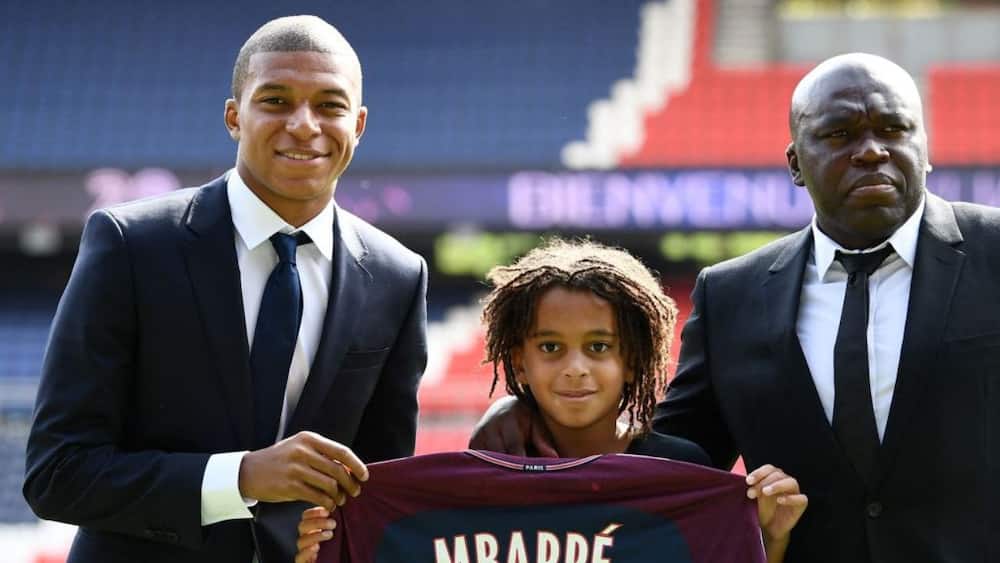 Kylian Mbappé (L) with his father Wilfried and brother Ethan